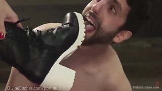 The muscled dominatrix is wrestling with her slaveboy