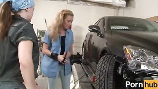 The sexy redhead and her friend are having fun in the garage, exploring their desires
