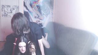 A couple enjoys intimate moments while watching a movie together
