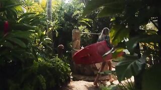A couple gets intimate on the beach while filming a vlog about their passionate encounter
