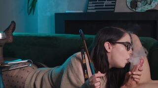 Nerdy girl with glasses smokes and sucks cock in 69 position