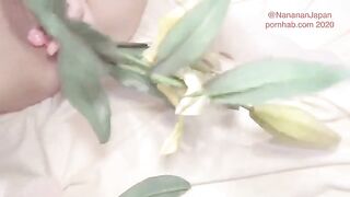 Bukkake with flowers in the ass of a shaved Japanese girl in a neat dress