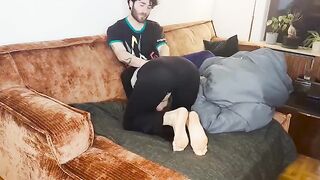 A couple has an intense intimate moment under the blanket, capturing real passion