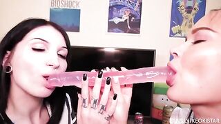 Two lesbian babes fuck each other with a double dildo