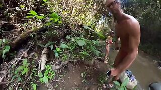 Couple engaged in passionate sex on the jungle river