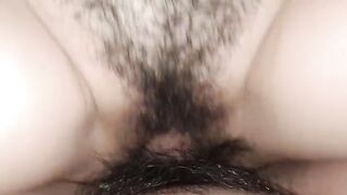 The woman has a wet and creamy pussy, which is being fucked