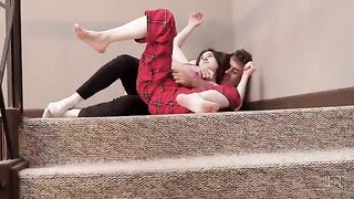 The stepsister sucks her brother’s cock on the stairs and fucks him hard