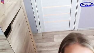 A sexy woman in stockings and rubber, trying on new underwear
