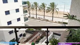 A couple engaged in public sex on the balcony, right by the sea