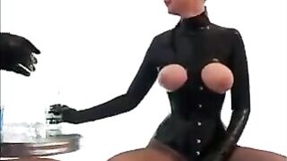 Lesbians wearing latex suits couldn't resist their desire for a threesome sex session