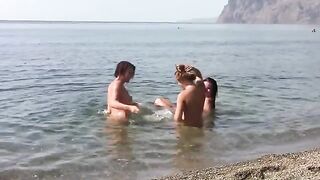 Three erotic piers on the public beach without clothes