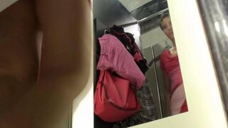 Spying for a girl in the changing room of the shop
