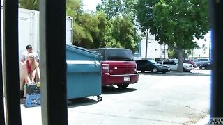A couple got intimate behind the garbage tank, unaware of being captured