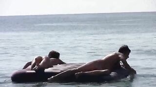A couple has naked sex on the beach with an amazing view