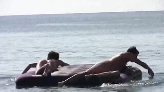 A couple has naked sex on the beach with an amazing view