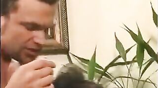 A 40-year-old man playing a joke with a girl's nipples