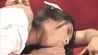 Asian nurse fucks with a guy on the couch in her uniform