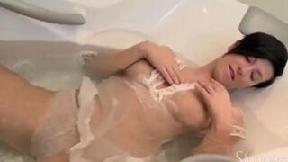 Hot brunette takes shower and masturbates her pussy