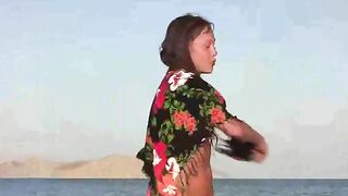 A member shows a naked girl on the beach