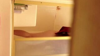 A girl washed in the shower, not knowing there was a camera
