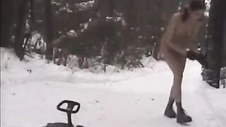 Naked beauties are having fun with snowballs on the street in the winter