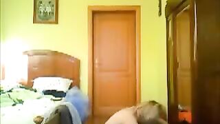 A peeping tom spies on a girl masturbating at home
