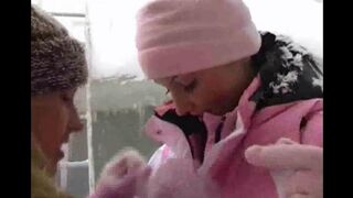Two girls are having fun on a cold winter day