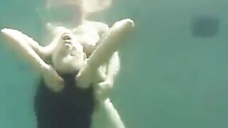 Busty brunette beauty has sex in the ocean, right in the water