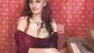 A girl with a natural hairstyle plays with her hairy pussy