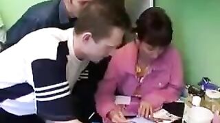Foursome sex with a Russian mother and three guys in the kitchen