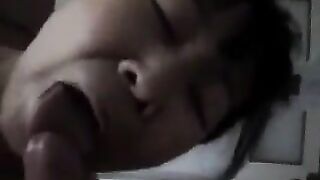 An old Chinese woman practices her blowjob skills on him