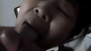 An old Chinese woman practices her blowjob skills on him