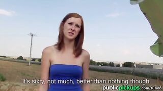A red girl is having fun with her boyfriend in the haystack
