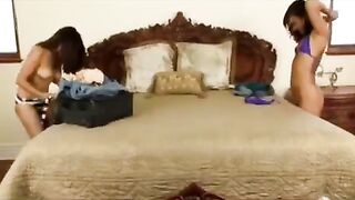 Asian girl fucks with a brunette in a passionate bedroom session