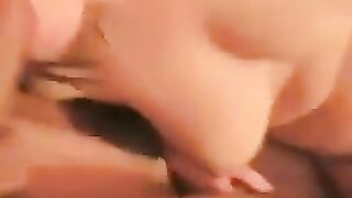 A juicy girl spreads her legs to show her raw pussy with a prominent clitoris