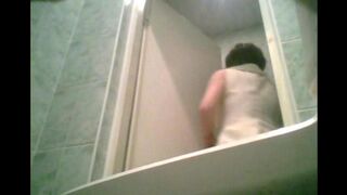 A girl is peeing after graduation in the toilet, cam hidden