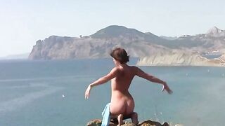 A girl is fucking on the sandy coast of the sea