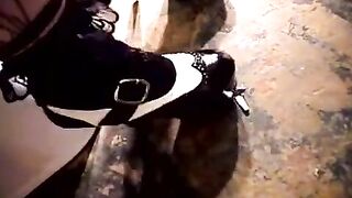A hot woman plays with her pussy on the toilet bowl
