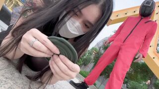 A hot Chinese girl plays a risqué version of the squid game