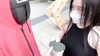 A hot Chinese girl plays a risqué version of the squid game