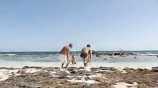 Bikini girls have a threesome sex with two guys on the beach