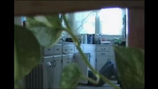 A married couple has fun while walking around naked in their apartment