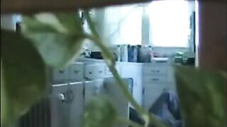 A married couple has fun while walking around naked in their apartment