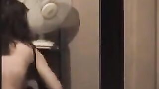The guy admires himself in the mirror completely naked