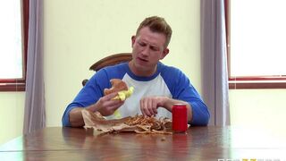A wife fucks herself with a cucumber in the kitchen