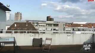 Brunette with big tits bounces on the roof in HD