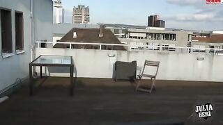 Brunette with big tits bounces on the roof in HD