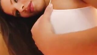 A girl plays with a dildo and gets her pussy wet on camera