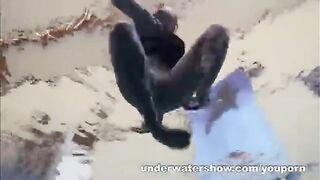 A busty girl is having fun in the pool without any clothes