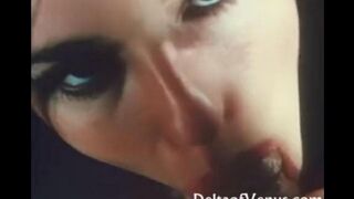 A beautiful woman makes blowjob to her lover in an old video